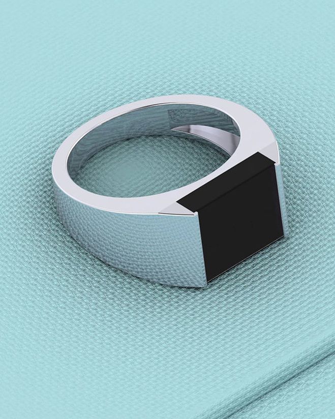 silver ring with black stone